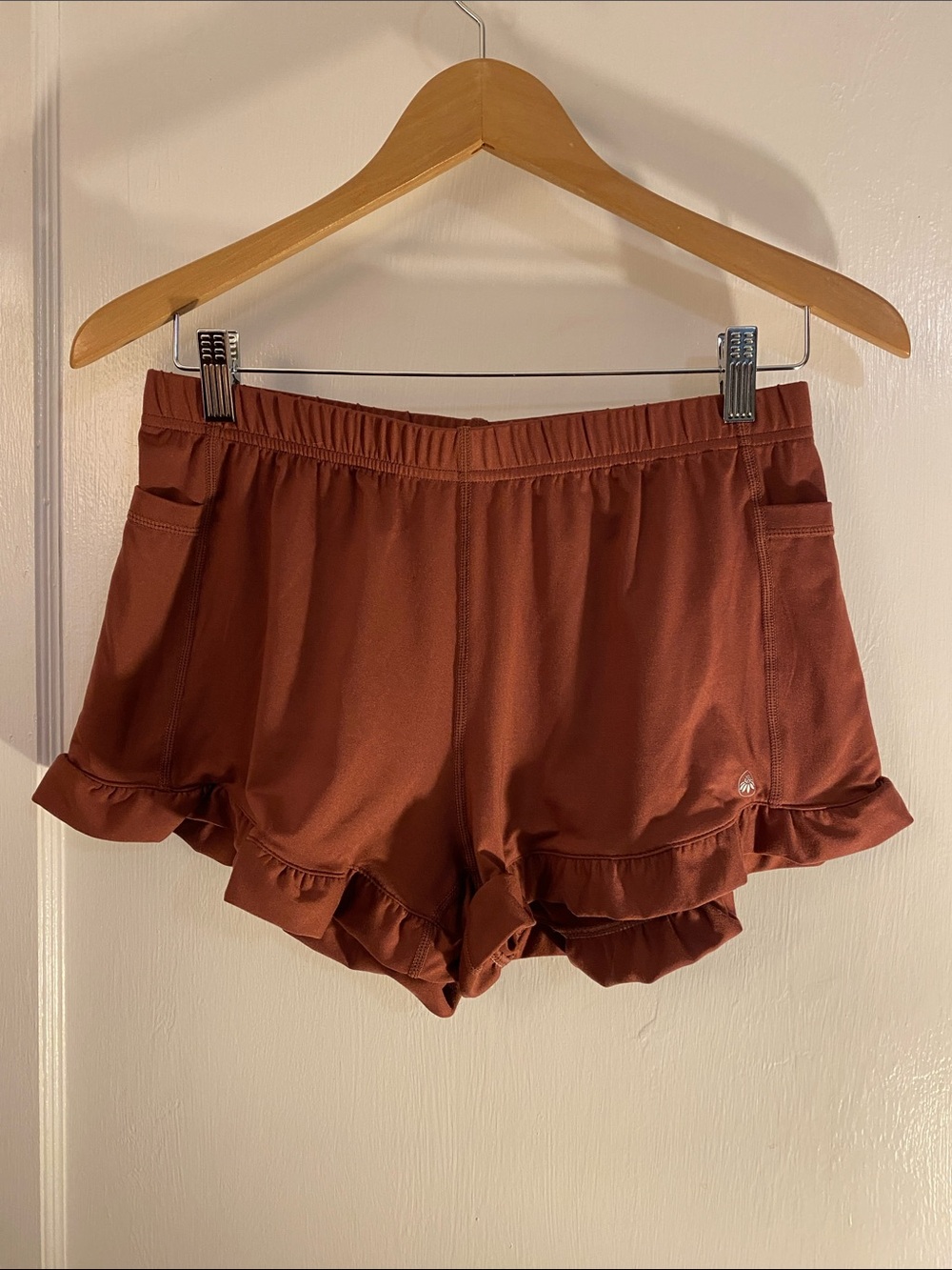 Senita Athletics Ruffle-Hem Athletic Shorts in Rust Small